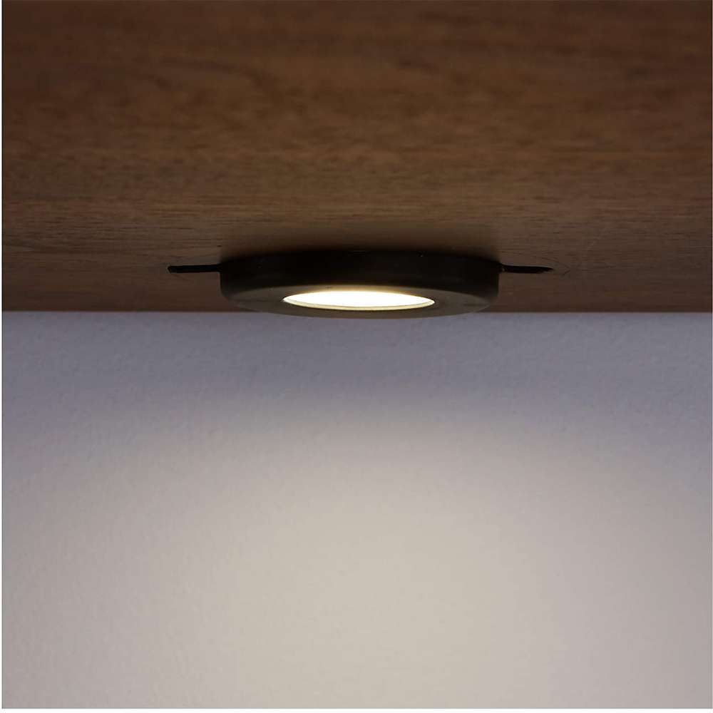 Built-in under-cabinet light on Crate & Barrel Tate Walnut Bookcase Desk with Outlet illuminates the workspace below