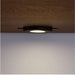 Built-in under-cabinet light on Crate & Barrel Tate Walnut Bookcase Desk with Outlet illuminates the workspace below