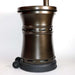 Built-in wheels and ventilation openings are visible on the bronze base of the Outdoor Order Curve Infrared Heater