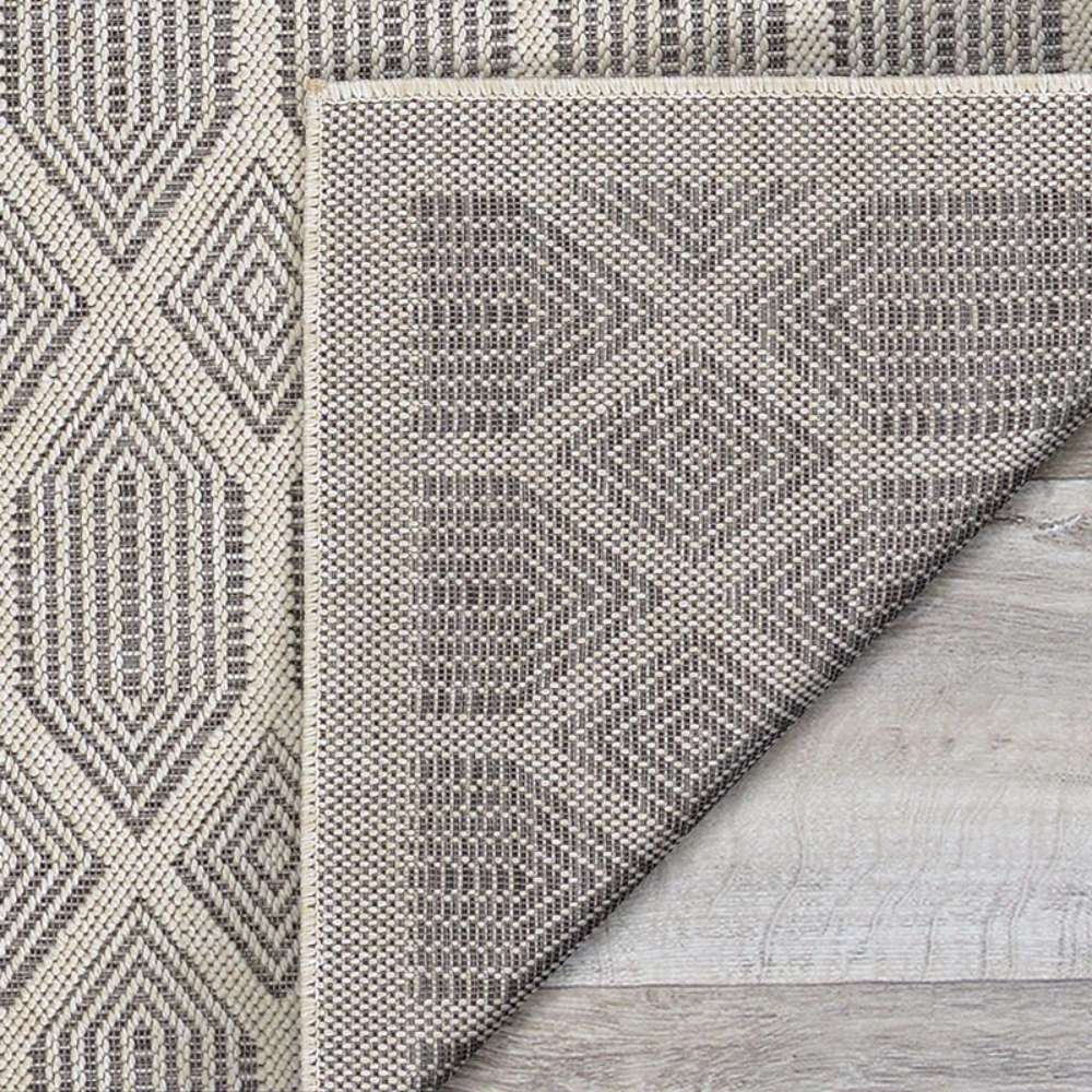 Cack corner of Couristan Liguria Indoor/Outdoor Rug - Rapallo/Pebble folded over, revealing its woven texture
