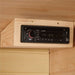 Car-style CD and FM radio unit mounted in the upper wood corner of Golden Designs Maxxus 3 Person Low EMF Far Infrared Sauna in Hemlock
