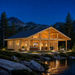 Caroline 90 glowing beside a Wyoming alpine lake while family and friends watch football inside.