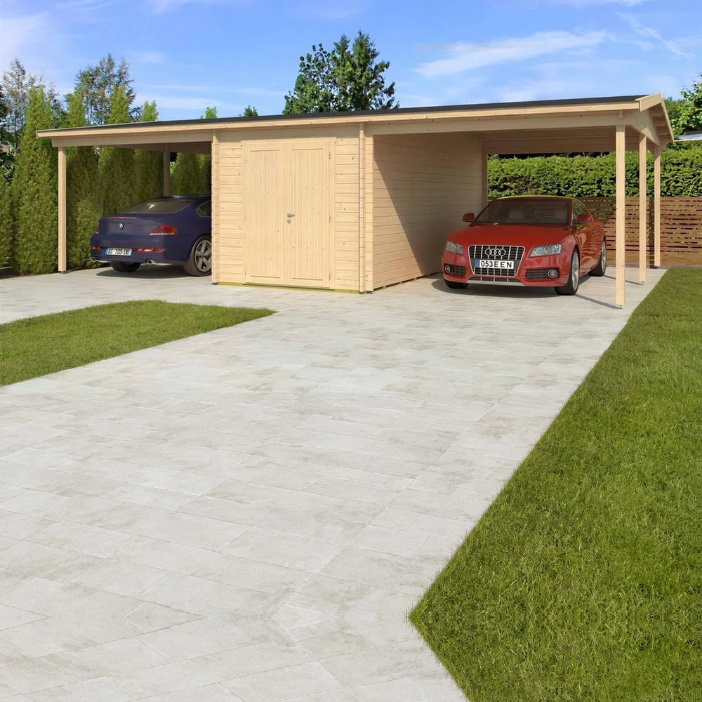 A spacious driveway leads up to the GardenHouse24 USA Carport Hans 70 Garden Room, which features two car bays and a central double-door storage shed