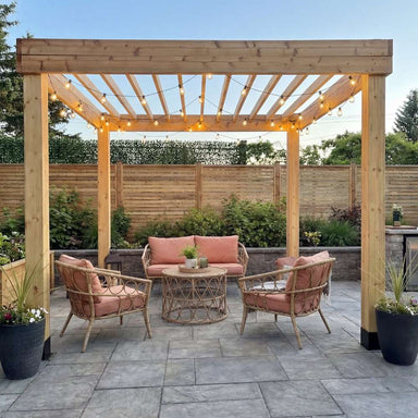 Centered pergola setup with outdoor furniture under the Outdoor Living Today Western Red Cedar Urban Escape Pergola