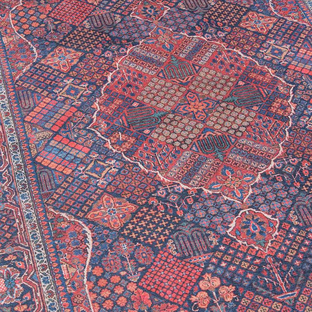 Central medallion and geometric motifs of Momeni Afshar Indoor Rug - AFS10 Navy showcasing its rich red, blue, and cream details