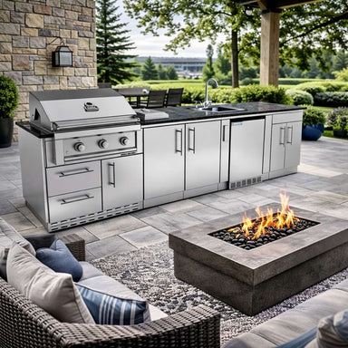 Sunstone Bayou 8ft 6in Outdoor Kitchen Island Package in a backyard with fire pit, grill, sink, and storage