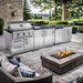 Sunstone Bayou 8ft 6in Outdoor Kitchen Island Package in a backyard with fire pit, grill, sink, and storage