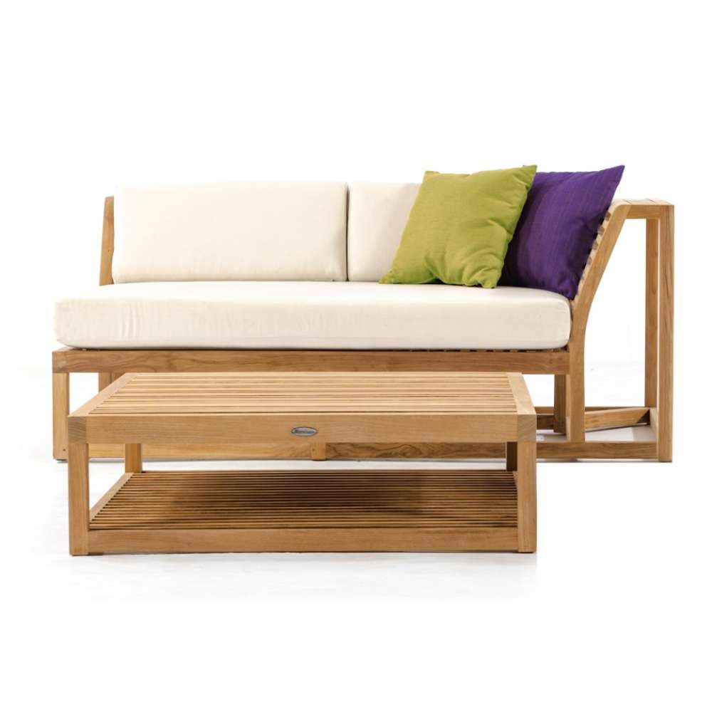Clean studio image shows Westminster Teak Maya Left Side Sectional with cushions and a matching coffee table, styled with two colorful throw pillows