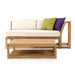 Clean studio image shows Westminster Teak Maya Left Side Sectional with cushions and a matching coffee table, styled with two colorful throw pillows