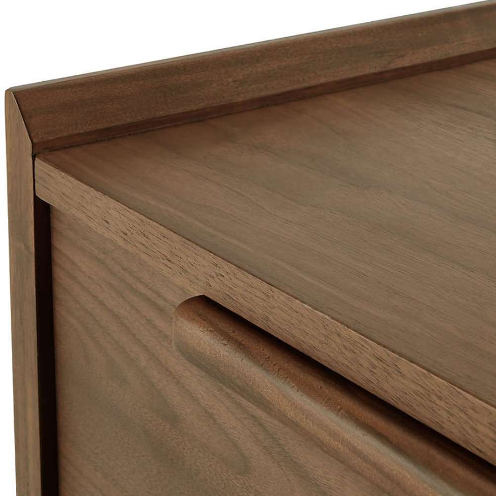 Close-up detail of Crate & Barrel Tate Walnut Lateral File Cabinet highlighting its smooth walnut grain and integrated drawer pull