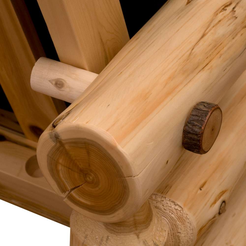 Close-up image shows Fireside Lodge Voyageur Futon featuring a rounded log joint with visible natural wood grain and bark detail