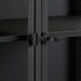 Close-up of Crate & Barrel Casement 32" Black Storage Cabinet highlights the black metal latch securing the glass cabinet doors