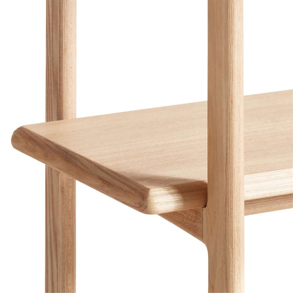 Close-up of Crate & Barrel Elias Natural Elm Wood Open Bookcase shelf highlighting its rounded edges and smooth natural wood grain