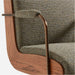 Close-up of Crate & Barrel Ellison Green Woven High-Back Office Chair highlighting woven fabric, wood detailing, and metal armrests