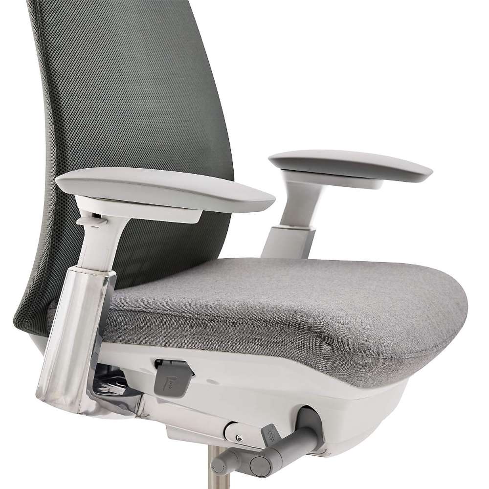 Close-up of Crate & Barrel Haworth Fern Upholstered River Rock Office Chair seat, adjustable armrests, and under-seat adjustment controls