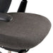 Close-up of Crate & Barrel Haworth Soji Upholstered Charcoal and Mesh Office Chair shows the cushioned charcoal upholstered seat with a smooth rounded edge