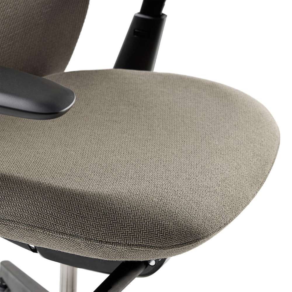 Close-up of Crate & Barrel Haworth Soji Upholstered Clay and Mesh Office Chair highlights the soft upholstered seat with rounded edges