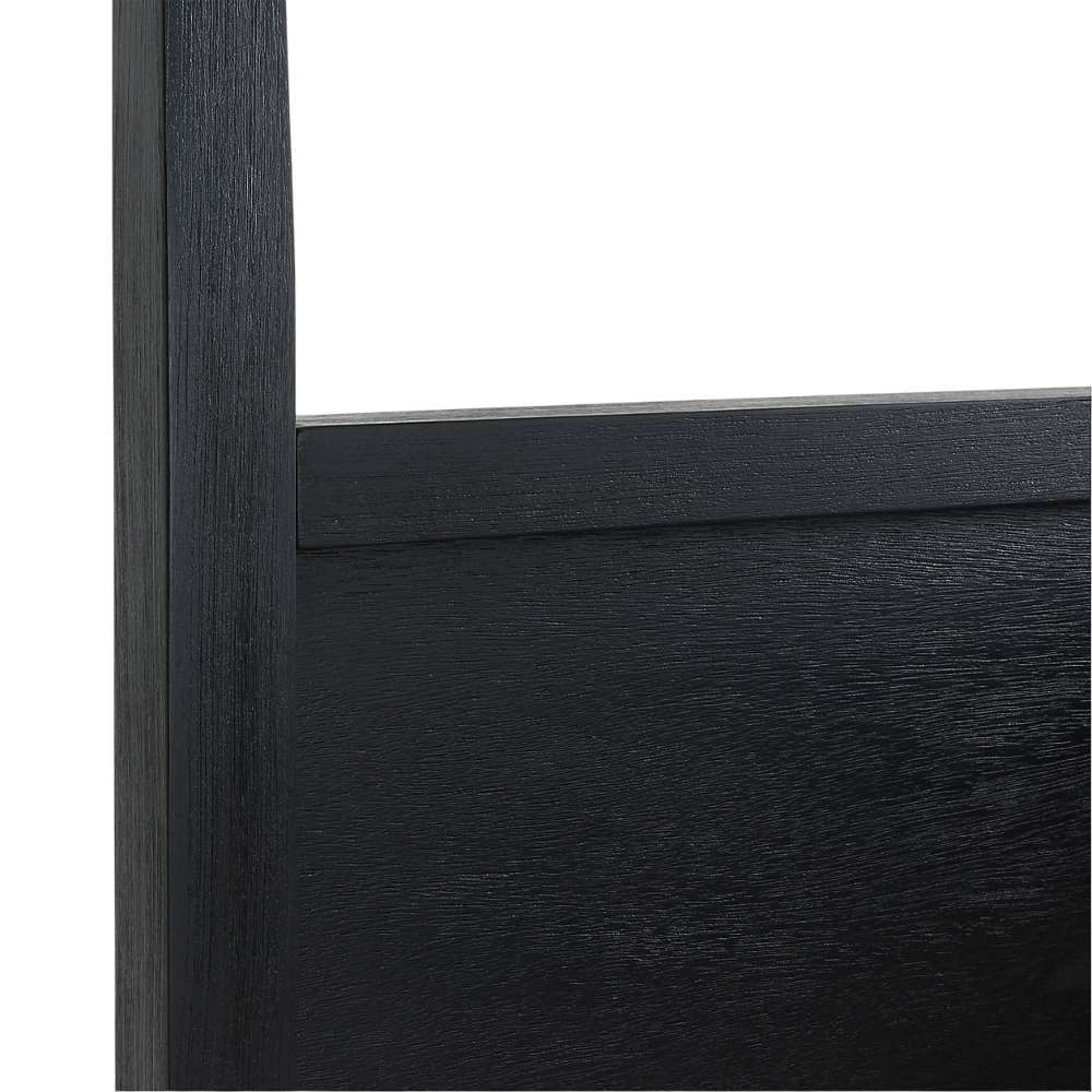 Close-up of Crate & Barrel Keane Black Solid Wood King Canopy Bed shows the solid wood headboard with a clean, modern black finish