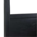 Close-up of Crate & Barrel Keane Black Solid Wood King Canopy Bed shows the solid wood headboard with a clean, modern black finish