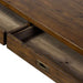 Close-up of Crate & Barrel Morris 48" Chocolate Brown Writing Desk with an open drawer showing the wooden interior