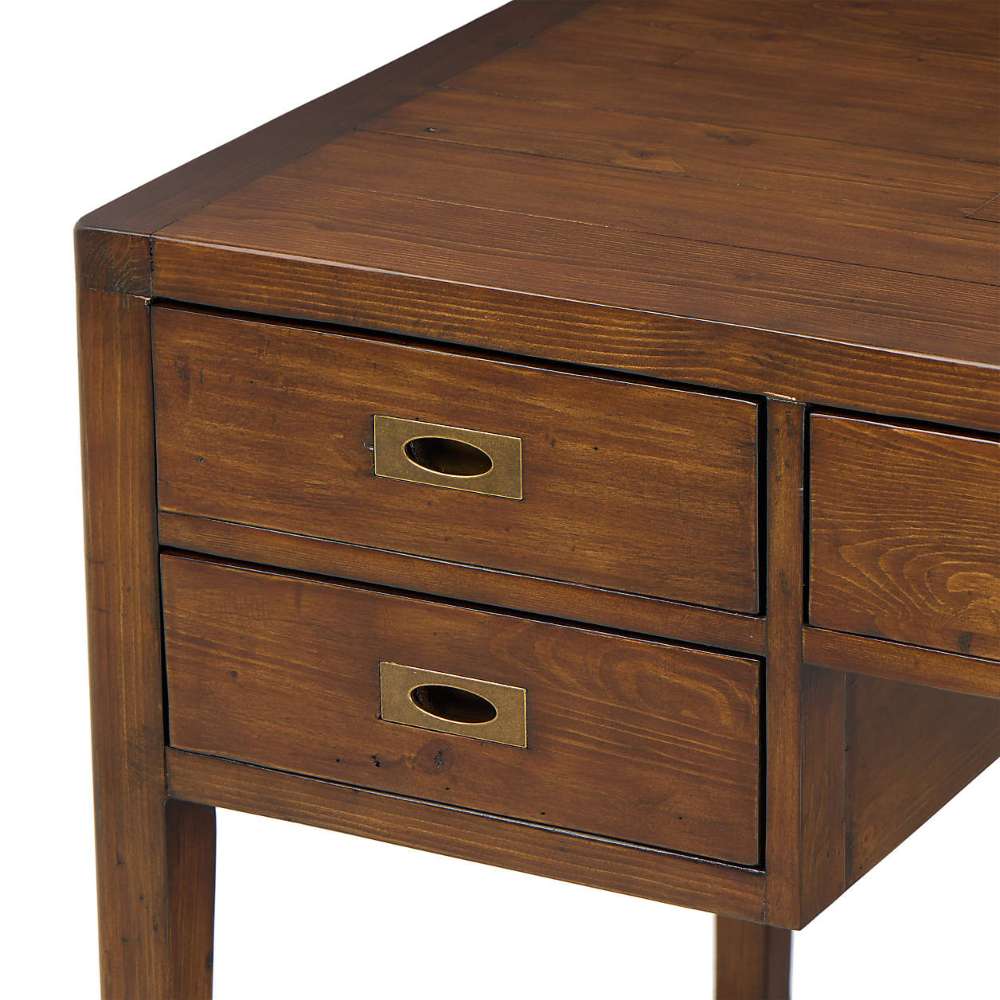 Close-up of Crate & Barrel Morris 60" Chocolate Brown Writing Desk highlighting its stacked side drawers and antique-style metal pulls