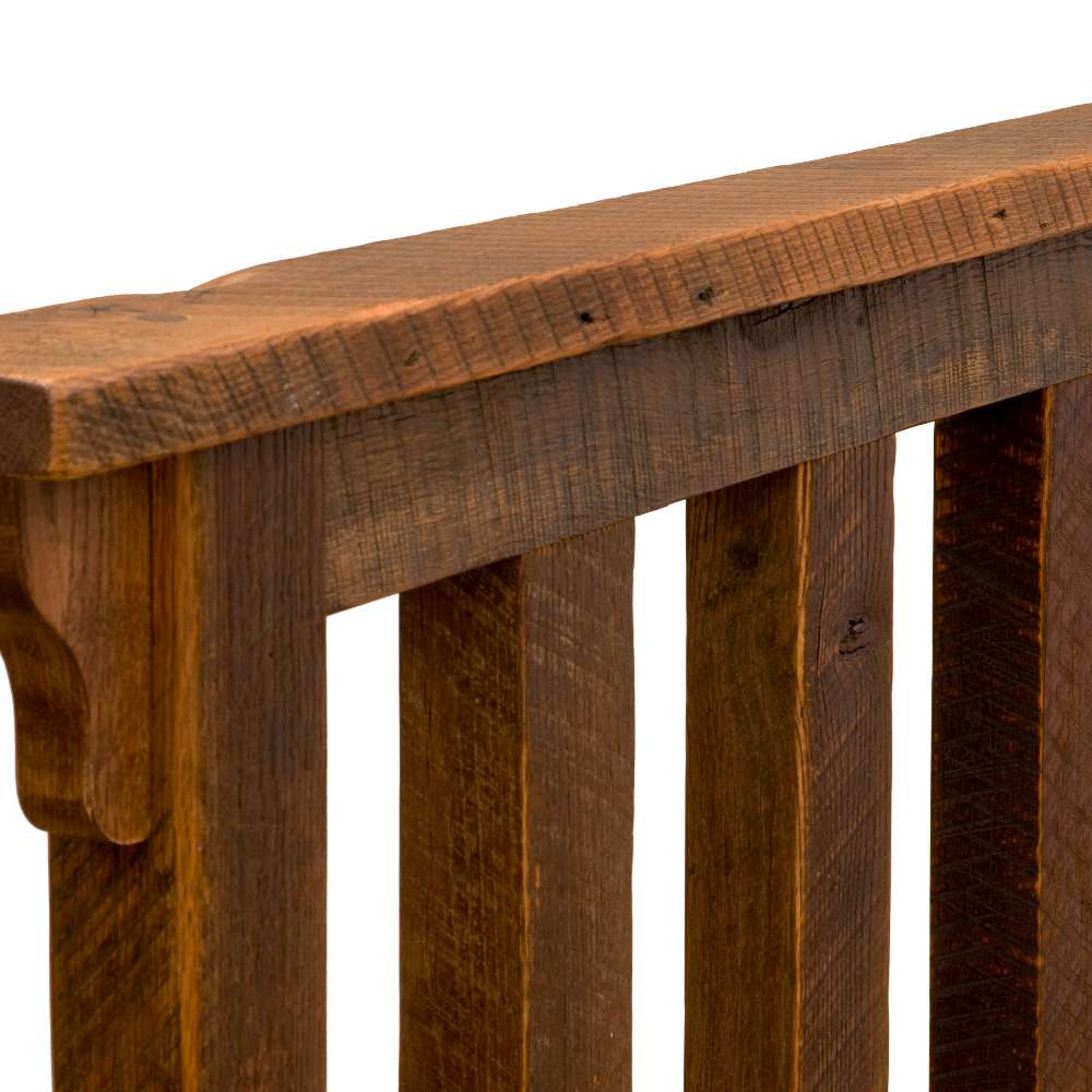 Close-up of Fireside Lodge Barnwood Post Bed headboard, focusing on the thick, rough-textured barnwood and vertical slats with a natural dark finish