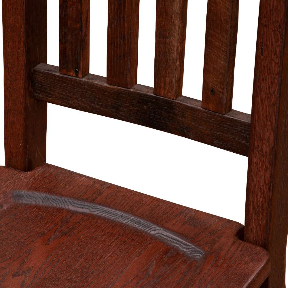 Close-up of Fireside Lodge Barnwood Prairie Dining Side Chair highlighting the rich barnwood grain and carved seat detail