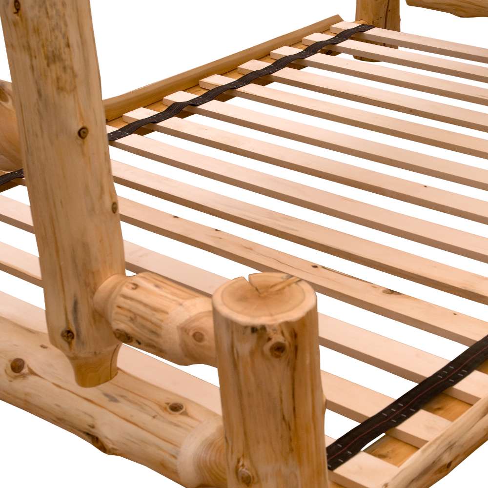 Close-up of Fireside Lodge Voyageur Tipi Bunk Bed shows the wooden slats and smooth log joints forming the bed base