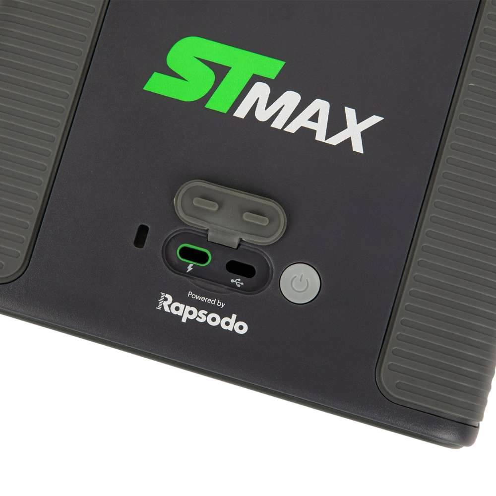 Close-up of SKYTRAK ST MAX Launch Monitor showing its USB ports, protective cover, and power button