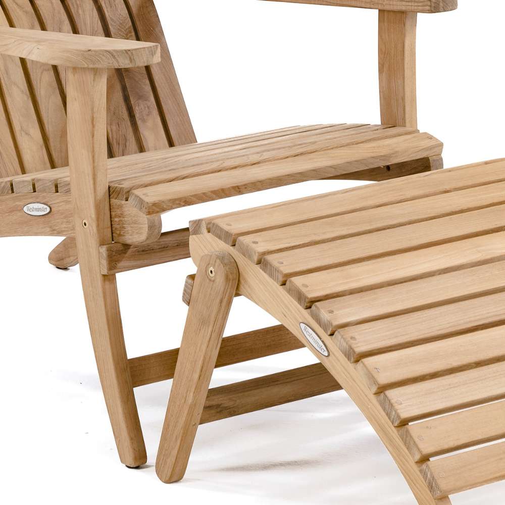 Close-up of Westminster Teak Adirondack Lounger and Ottoman showing the slatted teak seat and matching curved footrest on a white background