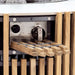 Close-up of Westminster Teak Agora Fire Table highlights the ignition control knob behind the slatted teak exterior