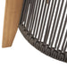 Close-up of Westminster Teak Luna Large Lantern shows tightly woven dark rope wrapped neatly around a circular frame next to a smooth wooden leg