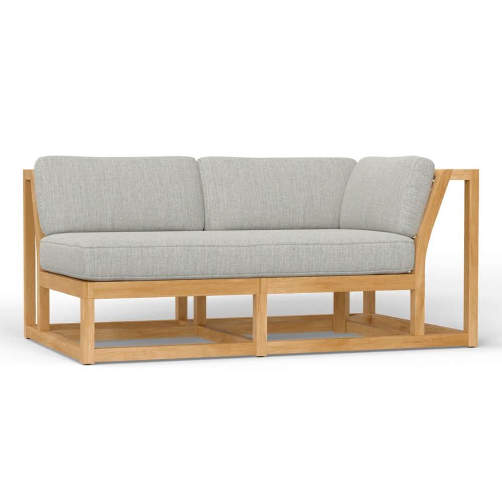 Close-up of Westminster Teak Maya Left Side Sectional reveals plush seat and back cushions resting on its wooden frame