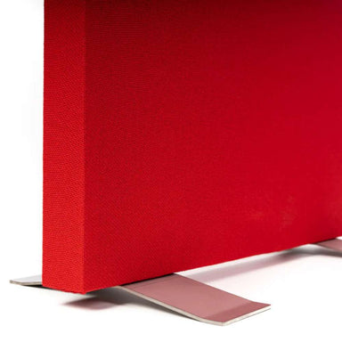 Close-up of a red acoustic panel standing securely on silver GIK Acoustics Freestand Feet with a low-profile metal design
