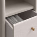 Close-up of an open drawer on Crate & Barrel Lafayette 64" Whitewashed Desk with Outlets with file dividers inside