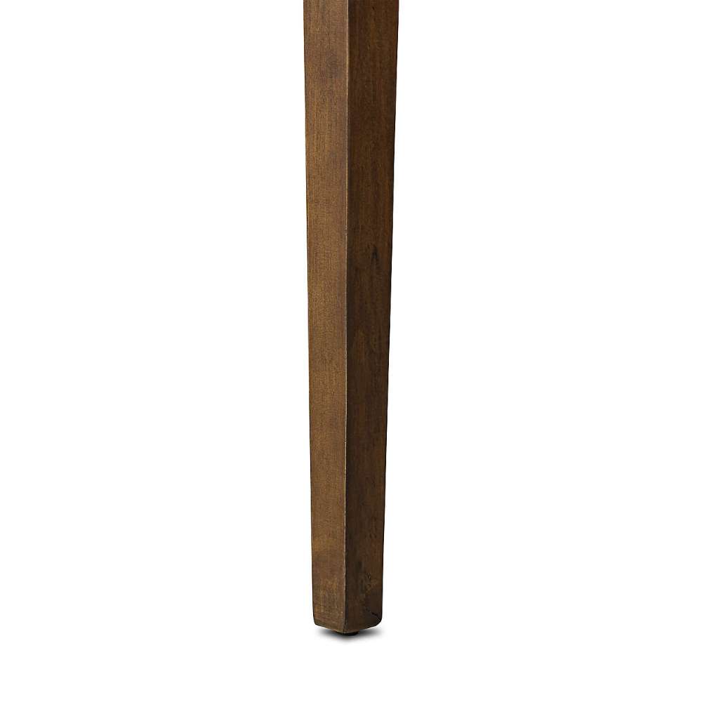 Close-up of one tapered leg on Crate & Barrel Morris 48" Chocolate Brown Writing Desk against a white background