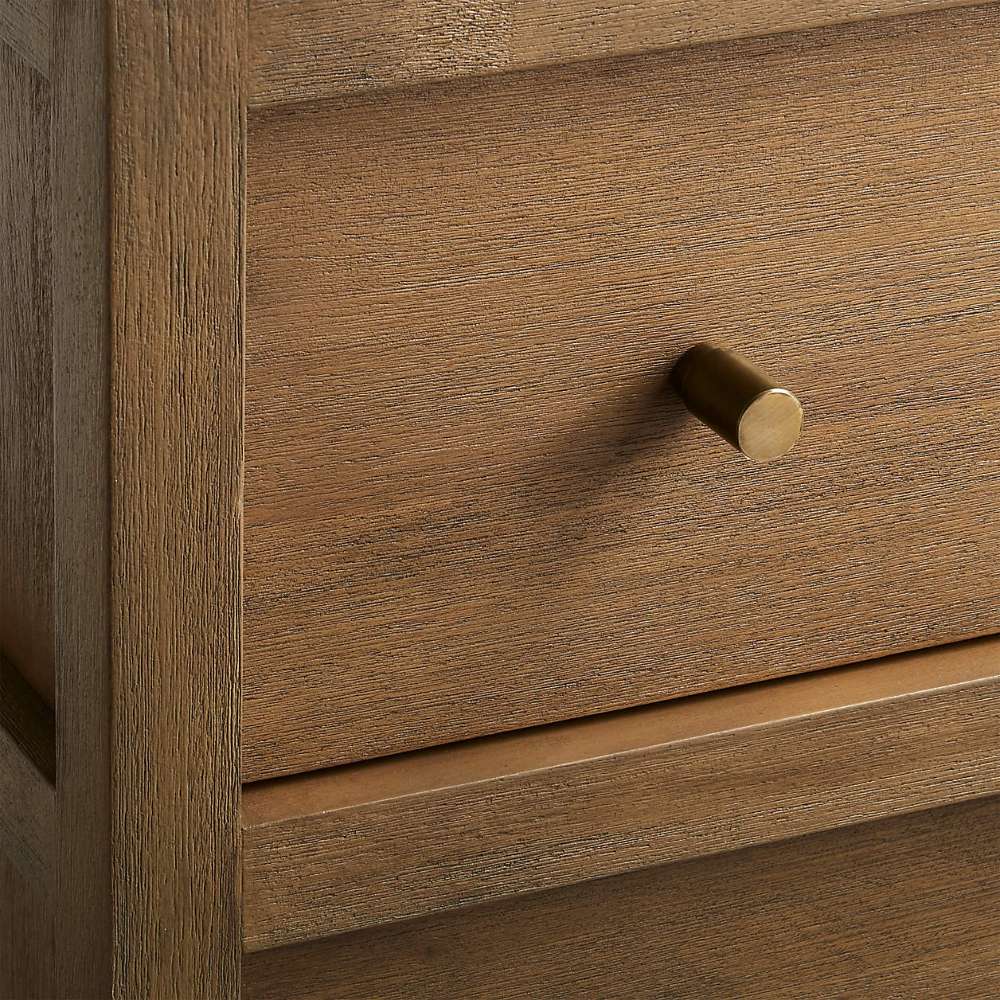 Close-up of the Crate & Barrel Keane 40" Driftwood Storage Bookcase highlighting its driftwood finish and brass knob