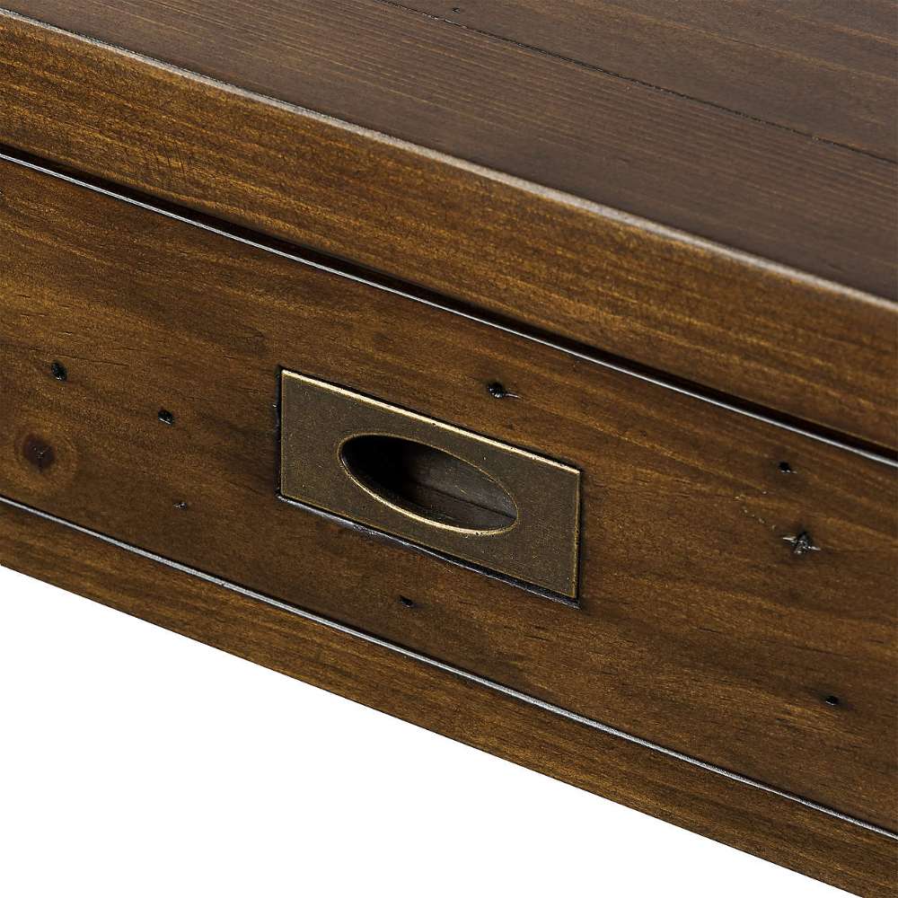 Close-up of the Crate & Barrel Morris 48" Chocolate Brown Writing Desk drawer front with an antique-style metal pull