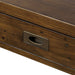 Close-up of the Crate & Barrel Morris 48" Chocolate Brown Writing Desk drawer front with an antique-style metal pull