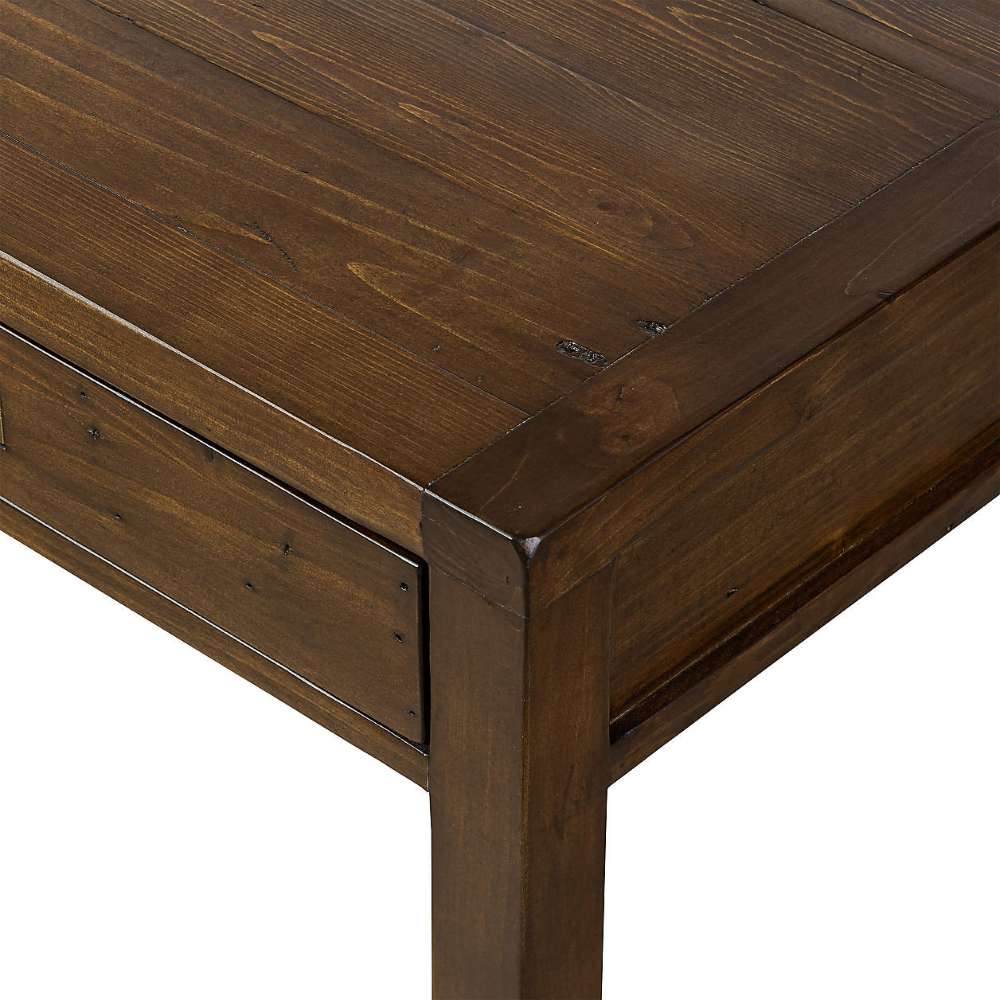 Close-up of the Crate & Barrel Morris 48" Chocolate Brown Writing Desk showing the textured wood grain and thick tabletop edge
