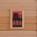 Close-up of the Golden Designs Monaco Near Zero EMF Far IR Sauna control panel in a wood frame, showing red 128 and 60 readouts above round buttons