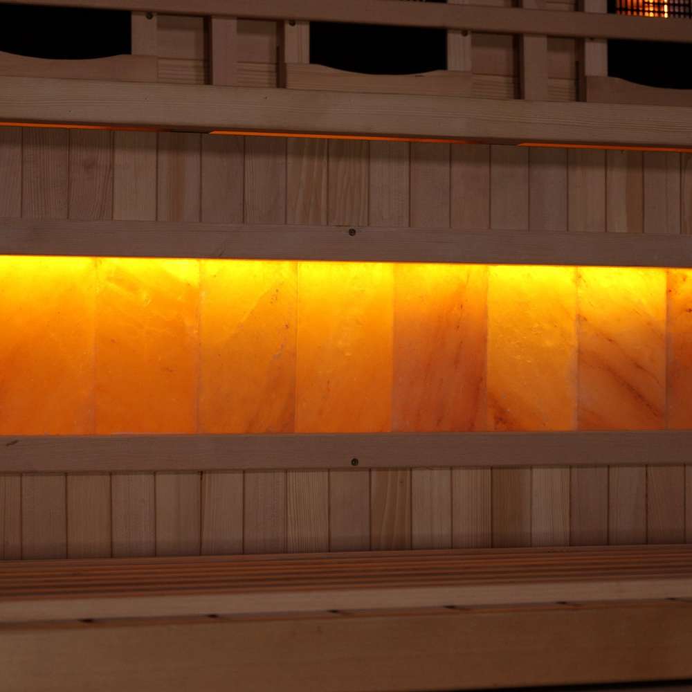 Close-up of the Himalayan salt bar in Golden Designs 2025 Reserve Edition 3 Person Full Spectrum Sauna with Himalayan Salt Bar, a row of glowing amber salt blocks below a bench