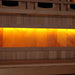 Close-up of the Himalayan salt bar in Golden Designs Reserve Edition 2 Person Full Spectrum Sauna with Himalayan Salt Bar, a row of glowing amber salt blocks below a bench