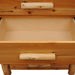 Close-up of the bottom drawer in Fireside Lodge Voyageur Four Drawer Chest reveals the spacious, unfinished interior ideal for storage