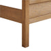 Close-up of the corner post and footboard on Crate & Barrel Keane Solid Driftwood Queen Bed showing the solid wood construction