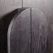 Close-up of the curved wood handle detail on the Crate & Barrel Annie 38" Charcoal Brown Storage Cabinet