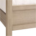 Close-up of the footboard corner on Crate & Barrel Keane Weathered Natural Solid Wood Queen Canopy Bed showing the weathered natural wood finish and sturdy frame