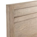 Close-up of the headboard on Crate & Barrel Keane Weathered Natural Solid Wood Queen Bed showing its textured wood grain and simple modern design