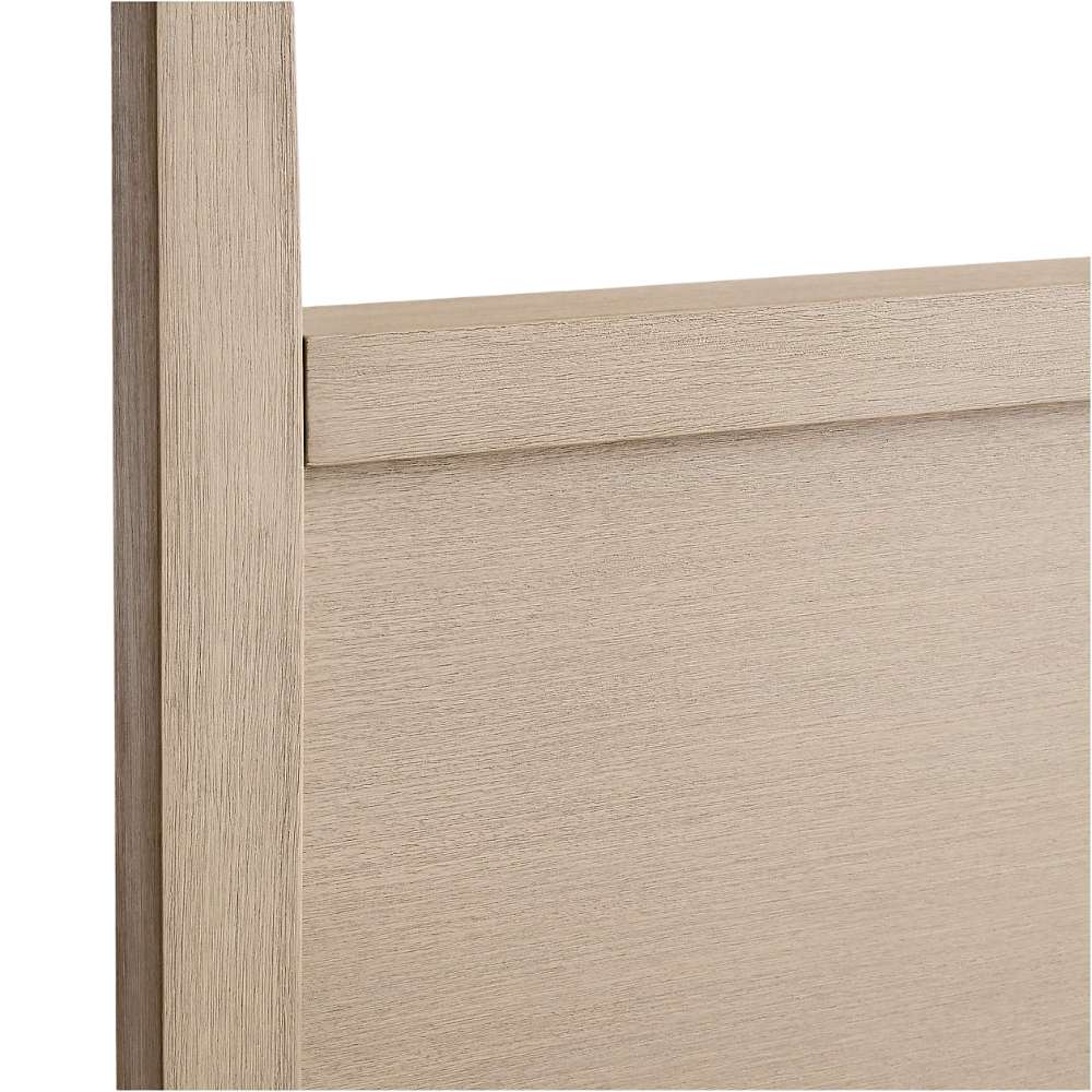 Close-up of the headboard wood grain on Crate & Barrel Keane Weathered Natural Solid Wood Queen Canopy Bed highlighting its weathered natural finish