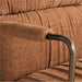 Close-up of the padded armrest and textured ginger fabric on Crate & Barrel Draper Ginger Upholstered Office Chair